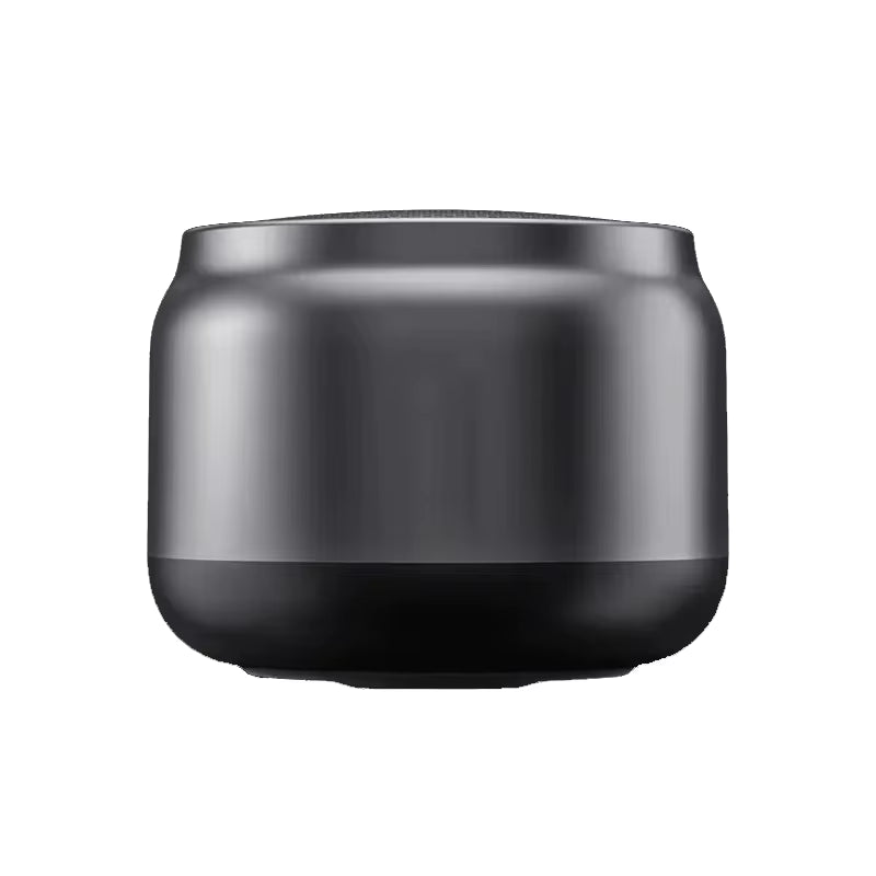 Compact black wireless Bluetooth speaker with rounded design on white background